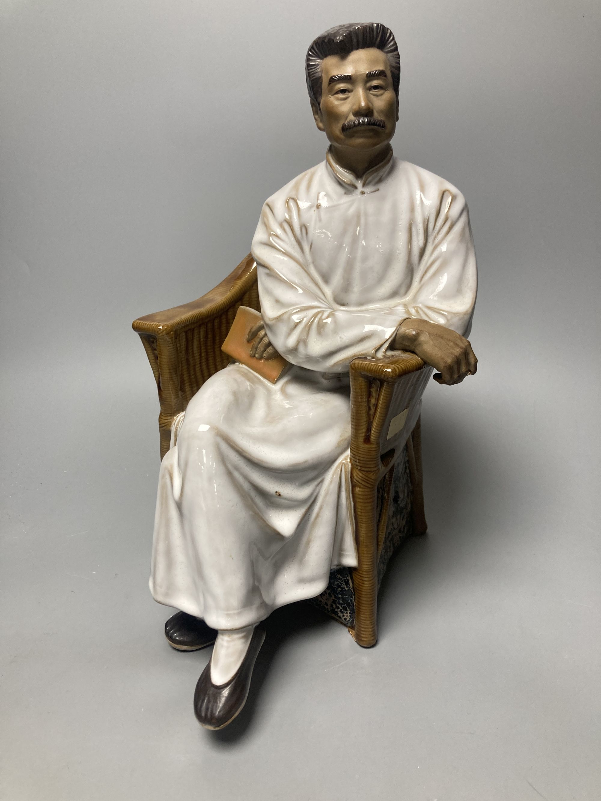 A Chinese Shiwan pottery figure of Lu Xun